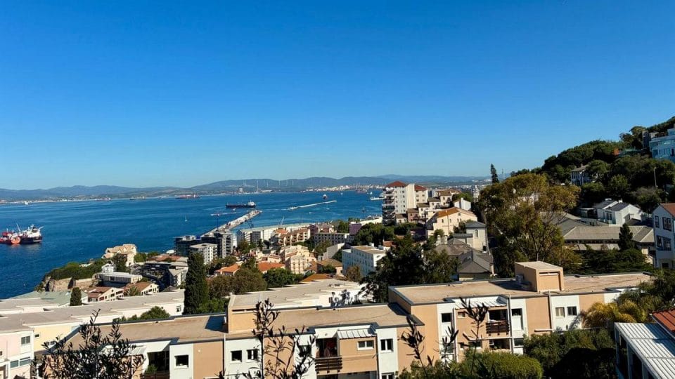 Residential properties and sea views from Gibraltar's South District, a popular area for retirees seeking a quieter lifestyle.